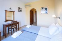 Postel nebo postele na pokoji v ubytování Vontzos Hotel