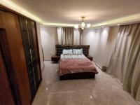 Postel nebo postele na pokoji v ubytování شقة مستوى فندقى المهندسين للعائلات فقط