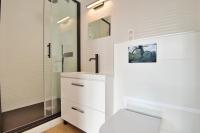 a bathroom with a toilet and a glass shower at Prestigious villa with panoramic sea view in Bandol