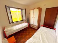 A bed or beds in a room at Residence Paguro