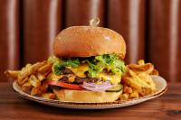 a plate with a sandwich and fries on a table at Hilton Orrington/Evanston in Evanston