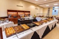 a buffet line with tables filled with lots of pastries at Hotel Riviera in Mar del Plata