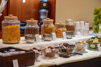 a table with several jars of food on it at Hotel Riviera in Mar del Plata