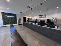 a restaurant with a bench in the middle of a counter at Friday Harbor Suites in Friday Harbor