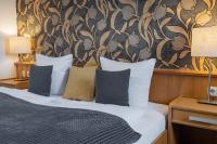 Łóżko lub łóżka w pokoju w obiekcie Hotel Rader