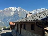 a house with a view of a mountain at Appartement Rémy - at the foot of the slopes in Saint-Gervais-les-Bains