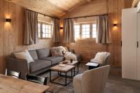 a living room with a couch and a table at Appartement Rémy - at the foot of the slopes in Saint-Gervais-les-Bains