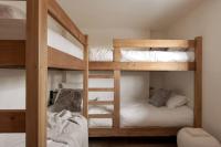 a couple of bunk beds in a room at Appartement Rémy - at the foot of the slopes in Saint-Gervais-les-Bains