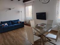 Televízia a/alebo spoločenská miestnosť v ubytovaní Ca' Monica Apartment
