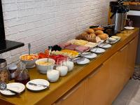 a buffet of food on a table in a kitchen at Pousada Vila de Pedra in Jericoacoara