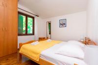 Łóżko lub łóżka w pokoju w obiekcie Apartments MARIJA