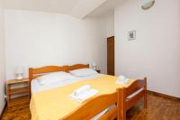 Łóżko lub łóżka w pokoju w obiekcie Apartments MARIJA