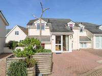 a large white house with a brick driveway at The Beach House in Newquay