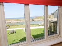 a window with a view of the ocean at The Beach House in Newquay