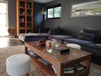 a living room with a couch and a coffee table at VILLA KB&#39;HOME in Le Touquet-Paris-Plage