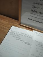a couple of pieces of paper on a table at VILLA KB&#39;HOME in Le Touquet-Paris-Plage