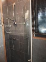 a bathroom with a shower with a glass door at VILLA KB&#39;HOME in Le Touquet-Paris-Plage
