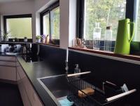 a kitchen with a sink and some windows at VILLA KB&#39;HOME in Le Touquet-Paris-Plage