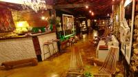 an overhead view of a living room with tables and chairs at Pousada Arte Urquijo in Paraty