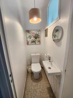 a small bathroom with a toilet and a sink at Maison proche Paris JO 2024 in Franconville