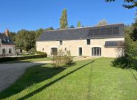 a large white house with solar panels on it at Les gîtes de La Pellerie - 2 piscines &amp; spa Jacuzzi - Touraine - 3 gîtes - familial, calme, campagne in Saint-Branchs