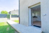 an open door of a house with a yard at Le studio du Doux in Tournon-sur-Rhône