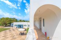 a view of the courtyard of a house with an archway at Promised Land B&amp;B in Taitung City