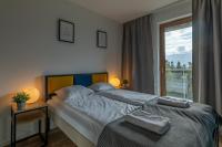 Posteľ alebo postele v izbe v ubytovaní RentPlanet - Apartamenty Schroniskowa