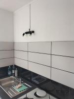 a kitchen with a sink and a counter top at Joli appartement proche métro in Lyon