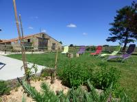 a group of chairs sitting in a yard at Gîte Le Bernard, 6 pièces, 10 personnes - FR-1-426-164 in Le Bernard