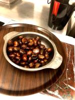 a bowl of chestnuts sitting on a table at Le Chambon, Chambres d&#39;hôtes in Saint-Merd-de-Lapleau