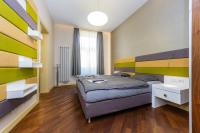 Postel nebo postele na pokoji v ubytování Bellevue Apartment