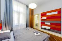 Postel nebo postele na pokoji v ubytování Bellevue Apartment