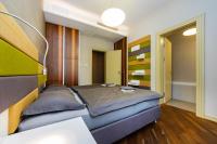 Postel nebo postele na pokoji v ubytování Bellevue Apartment