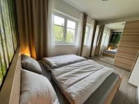 Postel nebo postele na pokoji v ubytování Apartmán SIX v Resortu pod Špičákem