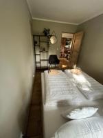 Łóżko lub łóżka w pokoju w obiekcie Ferienwohnung Anna Swinemünde Rycerska