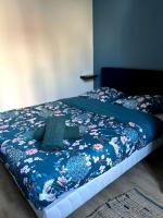 Una cama o camas en una habitaci&oacute;n de Le Green Twin