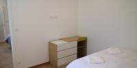 a small bedroom with a bed and a dresser at La chute des feuilles - Lit double- T2 Hyper centre in Abbeville