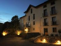a large white building with lights in front of it at Domaine Agricole Cotzé &#47; Casa rural in Enveitg