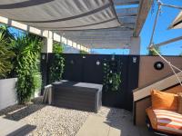Patio nebo venkovní prostory v ubytování Superbe appartement avec solarium et piscine communautaire