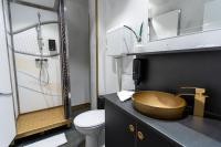 a bathroom with a wooden sink and a toilet at Timeout Heritage Hotel Zagreb in Zagreb