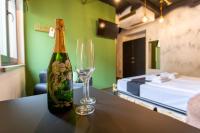 a bottle of champagne and a glass on a table at Timeout Heritage Hotel Zagreb in Zagreb