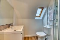 a bathroom with a white toilet and a sink at Le Nature, un joli F2 au cœur de Rouen Rive Droite in Rouen