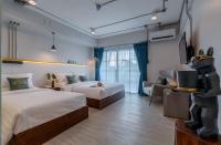 Postel nebo postele na pokoji v ubytování Momo Hotel