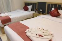 Postel nebo postele na pokoji v ubytování Locanda Pyramids Hotel