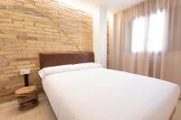 A bed or beds in a room at Casa Tai