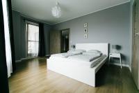 Posteľ alebo postele v izbe v ubytovaní RENTTNER Apartamenty