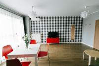 Televízia a/alebo spoločenská miestnosť v ubytovaní RENTTNER Apartamenty