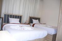 Postel nebo postele na pokoji v ubytování Locanda Pyramids Hotel