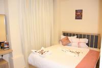 Postel nebo postele na pokoji v ubytování Locanda Pyramids Hotel